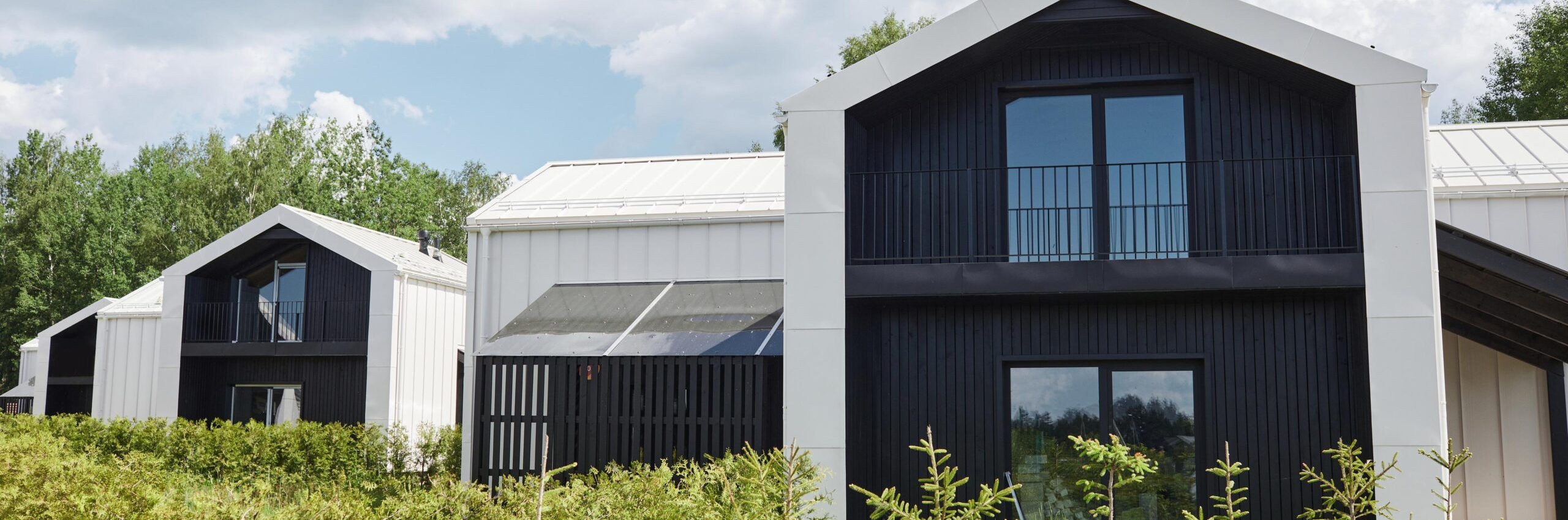 Background image of graphic houses designed with minimal Scandinavian aesthetic in black and white colors, copy space